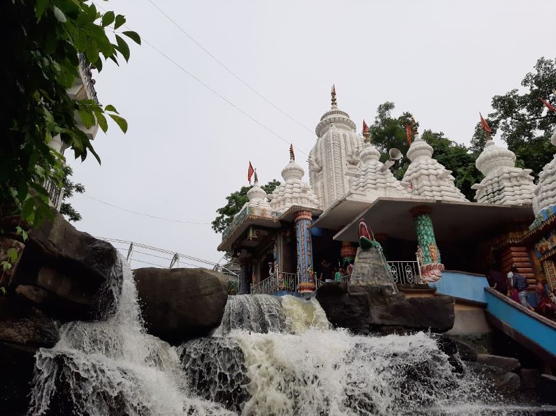 river flowing side of temple