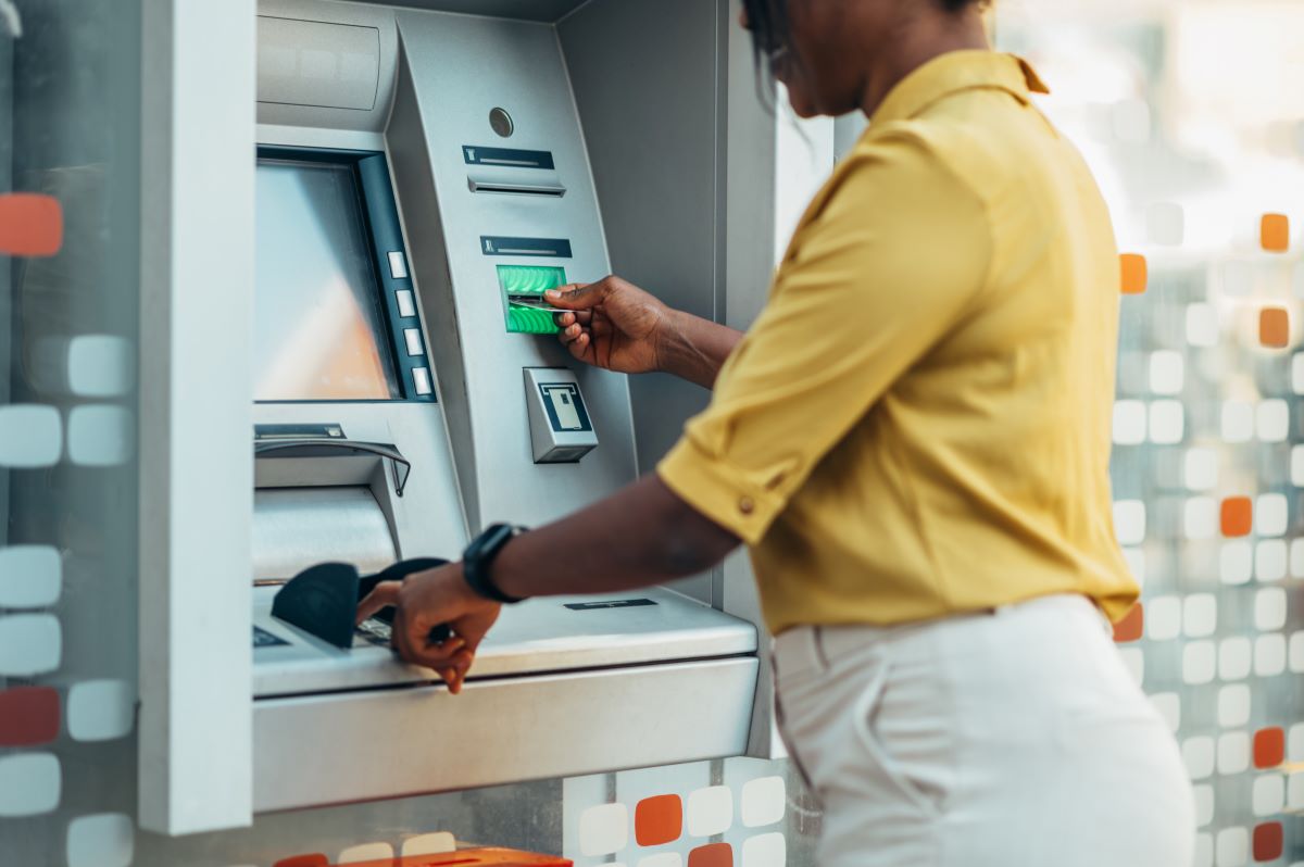 young girl at atm