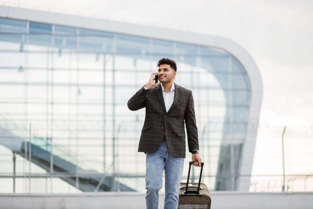 man at call with luggage