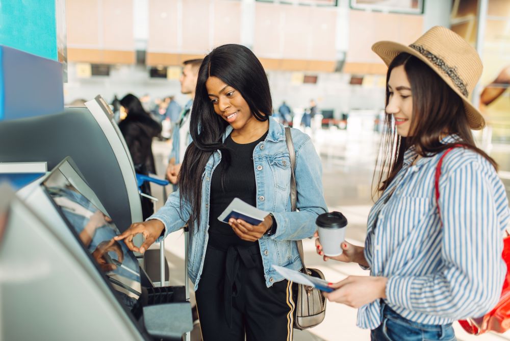 two girls at atm