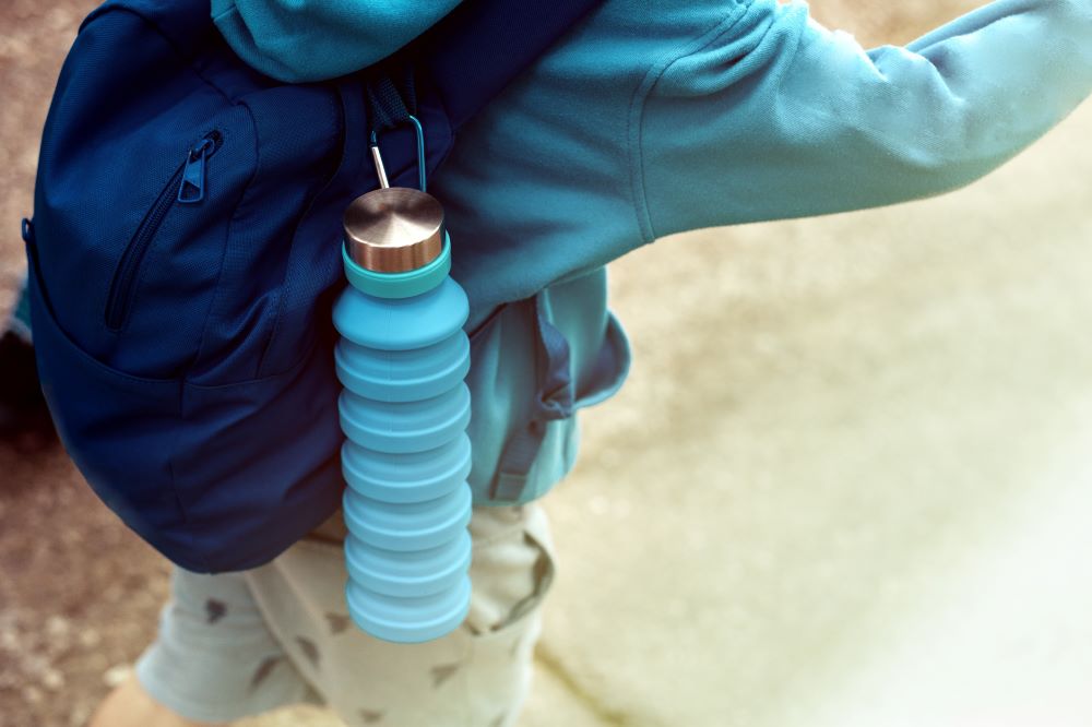 backpack of a child with a foldable reusable water