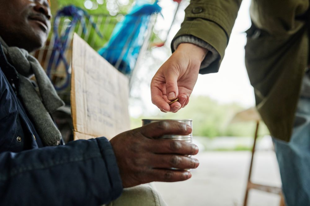 a beggar collecting money