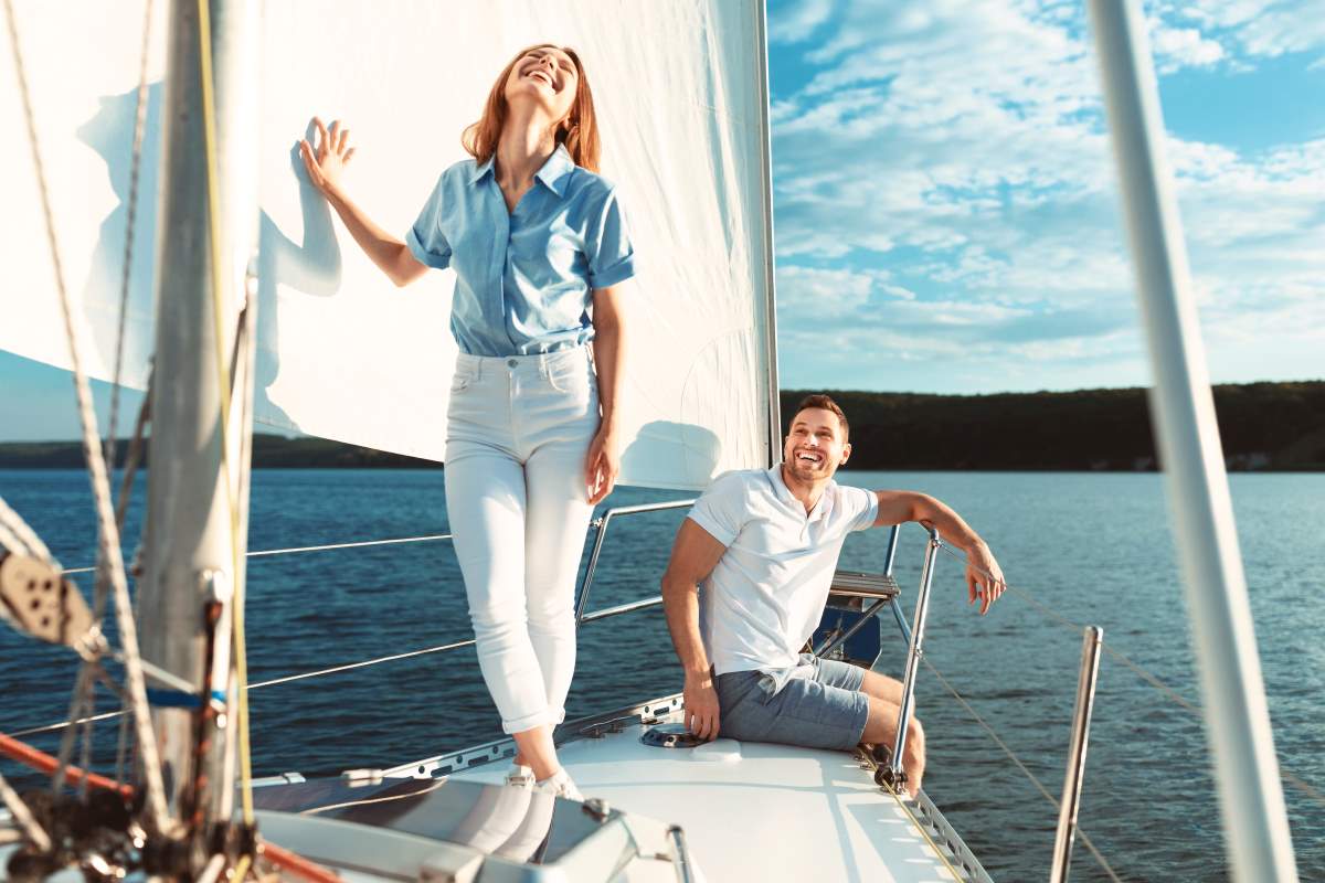 a couple at boat sailing in sea