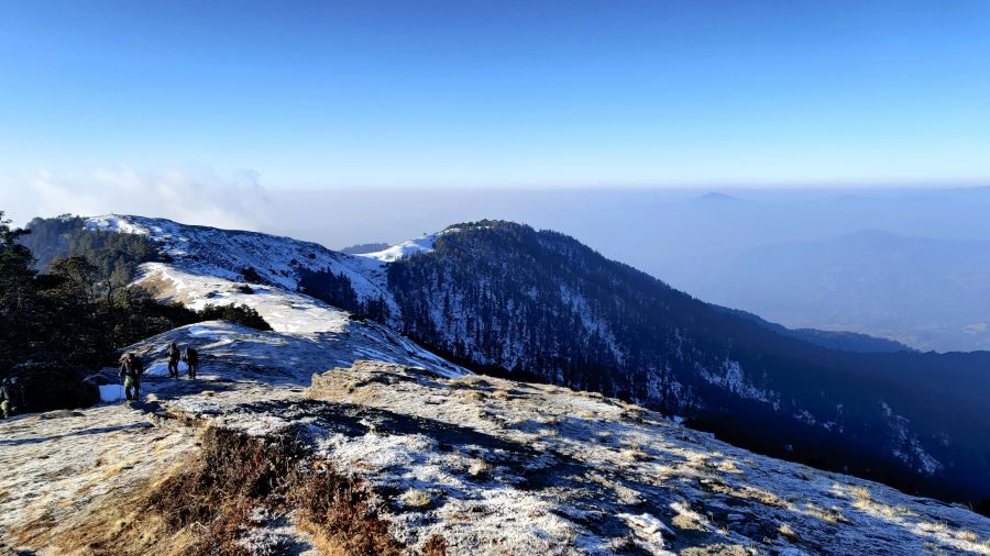 people walking through mountains