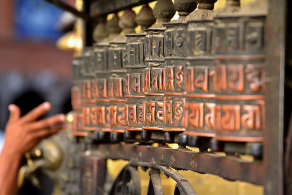 buddhist prayer wheels in swayambhunath nepal