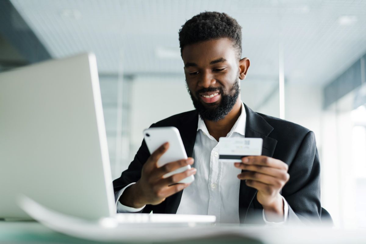 A businessman holding a business credit cards