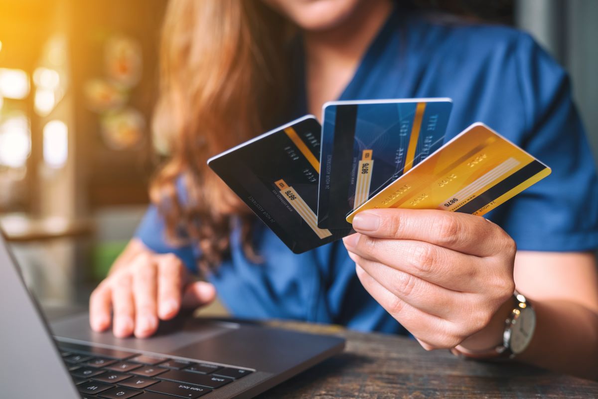 A business woman holding a credit card for doing transactions