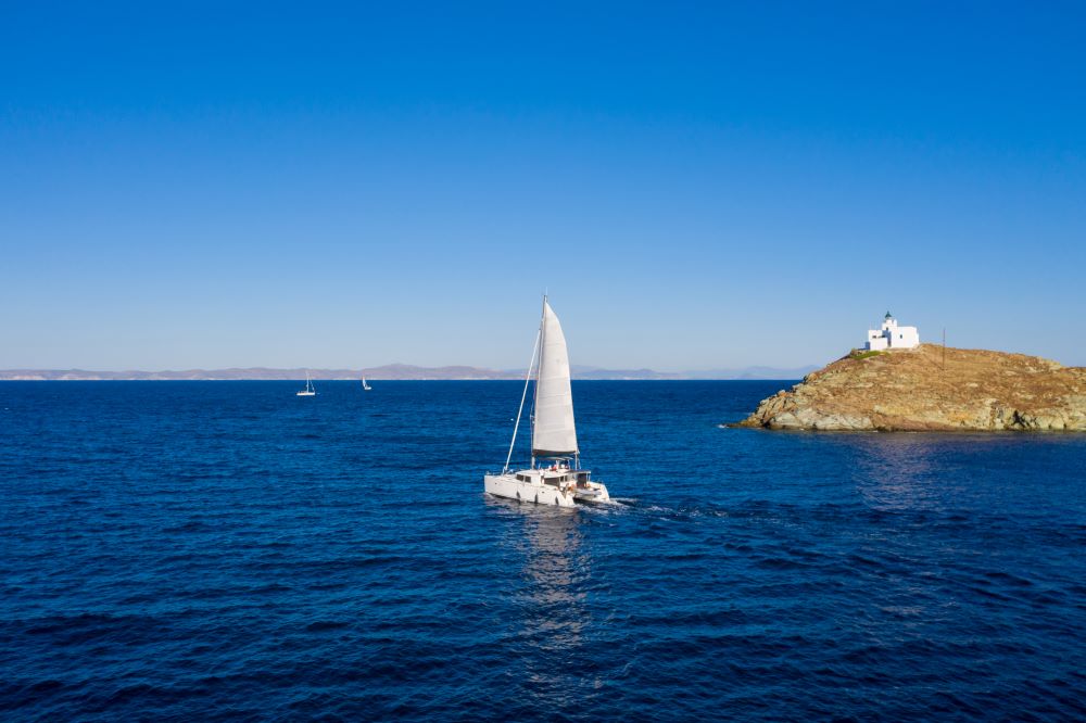 white catamaran cruise in sea