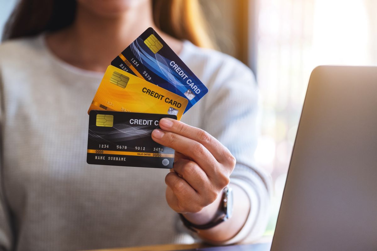 women showing a different credit cards