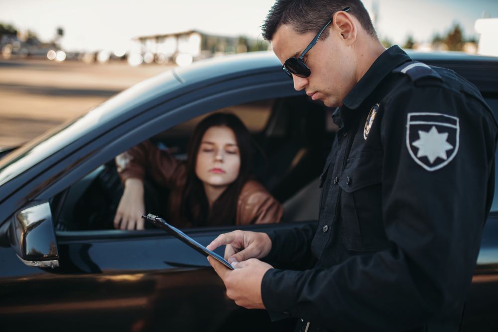 cop checking drivers document