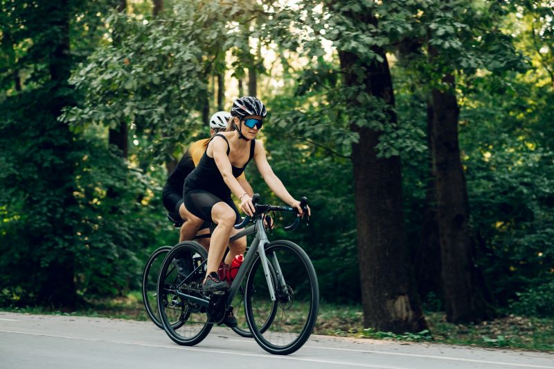 couple-riding-bicycles-outside-of-the-city