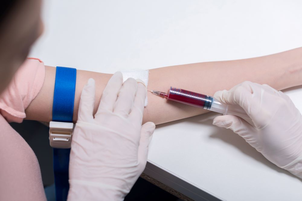 cropped-shot-of-doctor-doing-blood-test