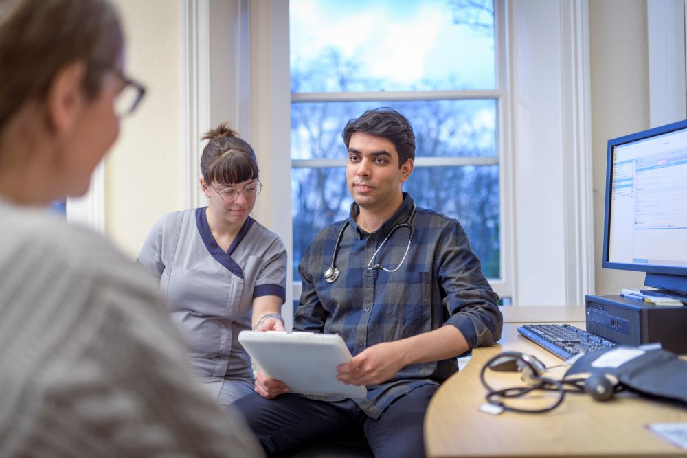 doctor-and-nurse-talking-to-patient