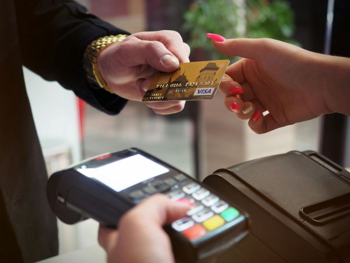 a man shopping duty free using card