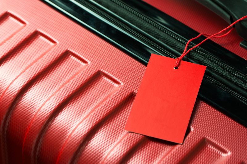 red luggage with red luggage tag