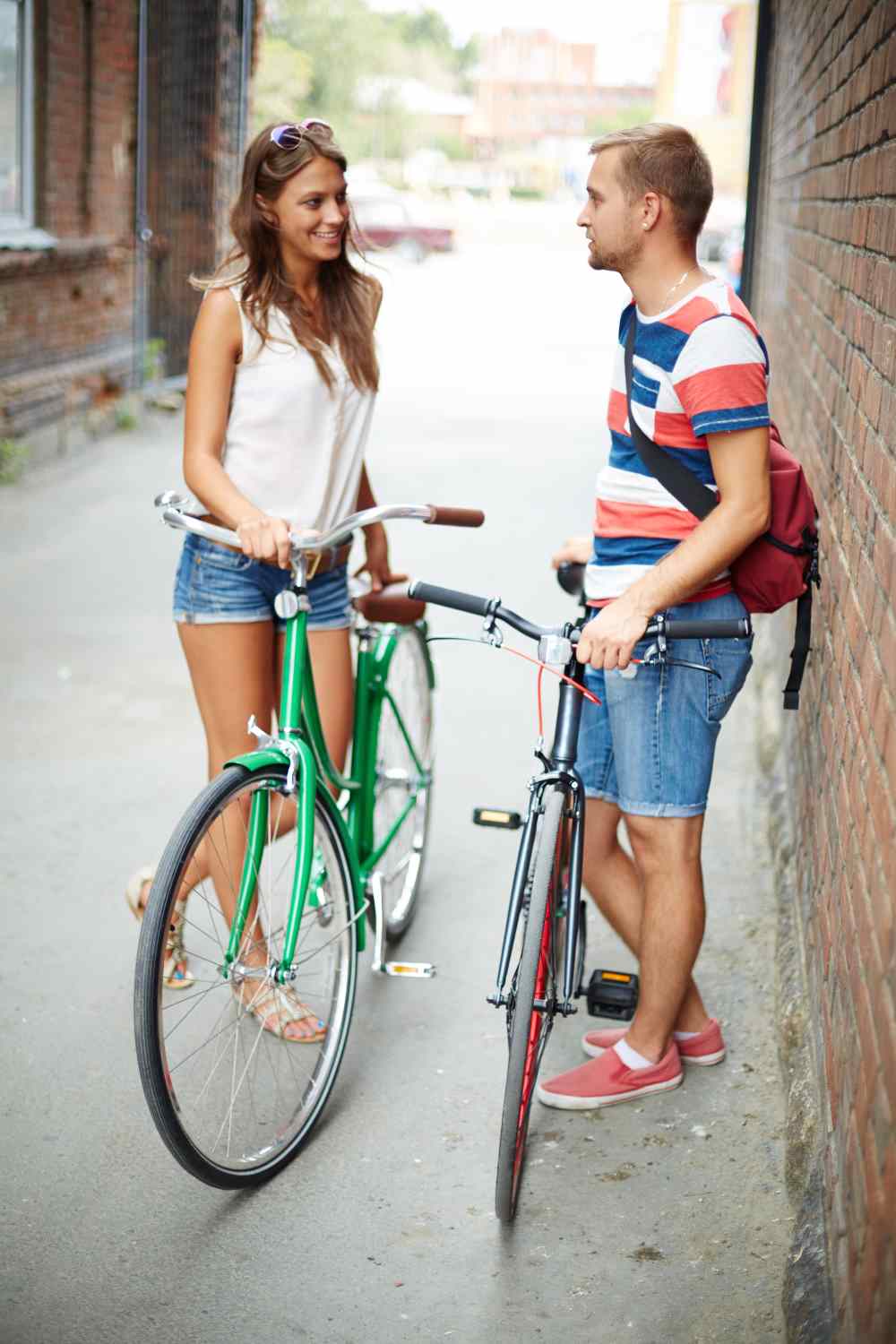 two folks talking to each other on street