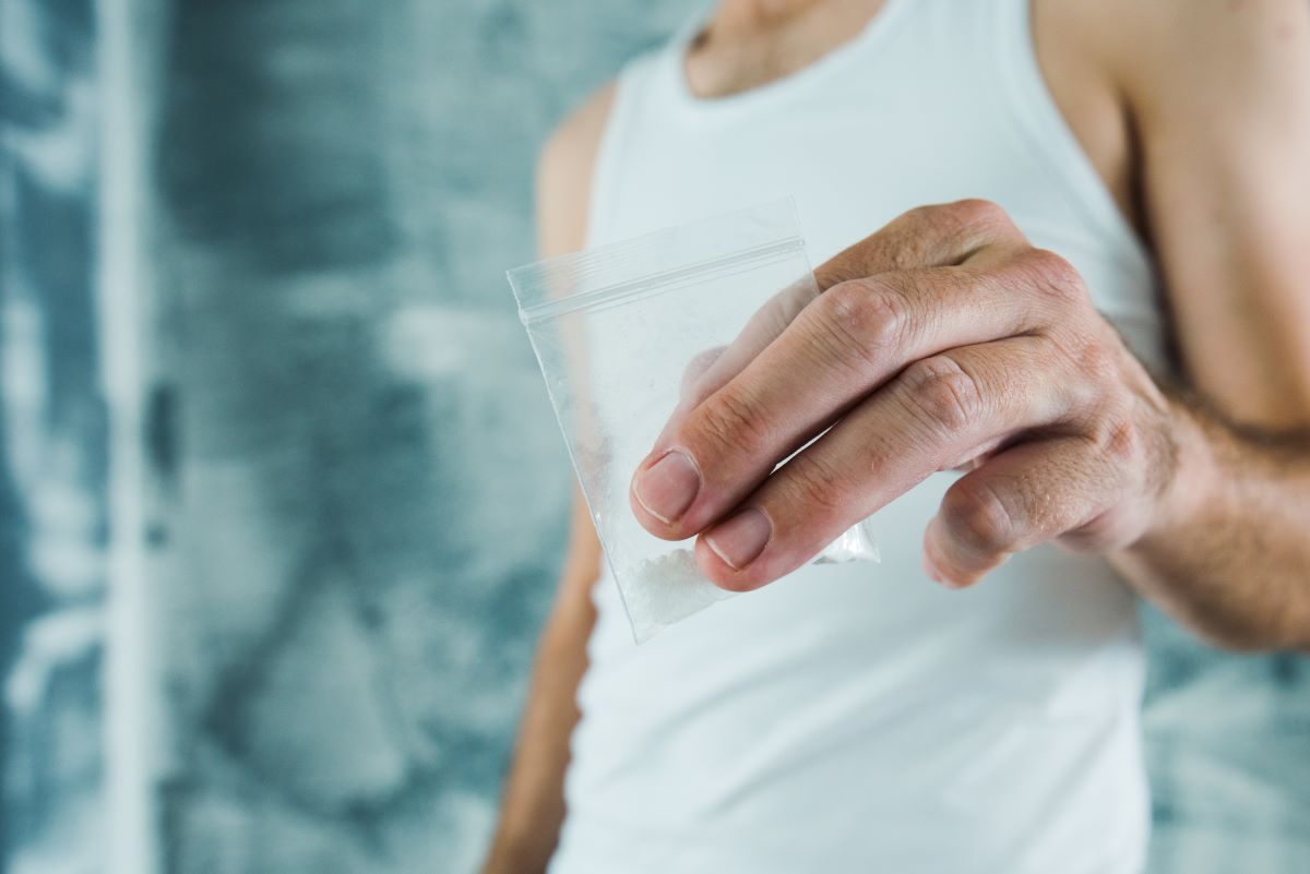 a man with small transparent packet