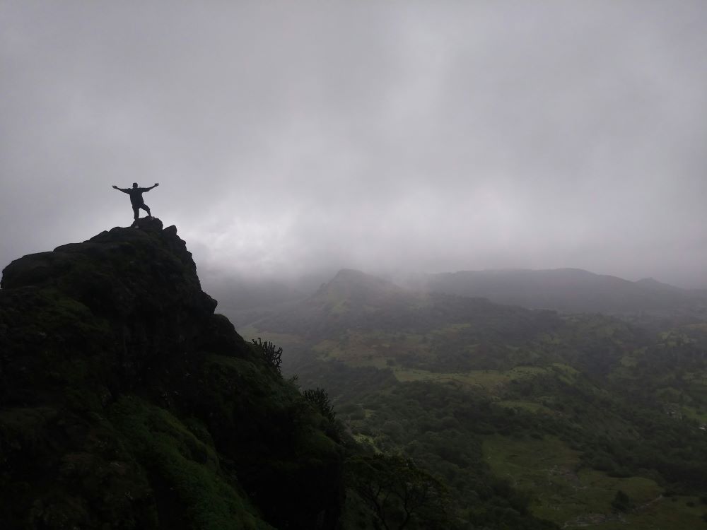 a guy at the top of harihar fort