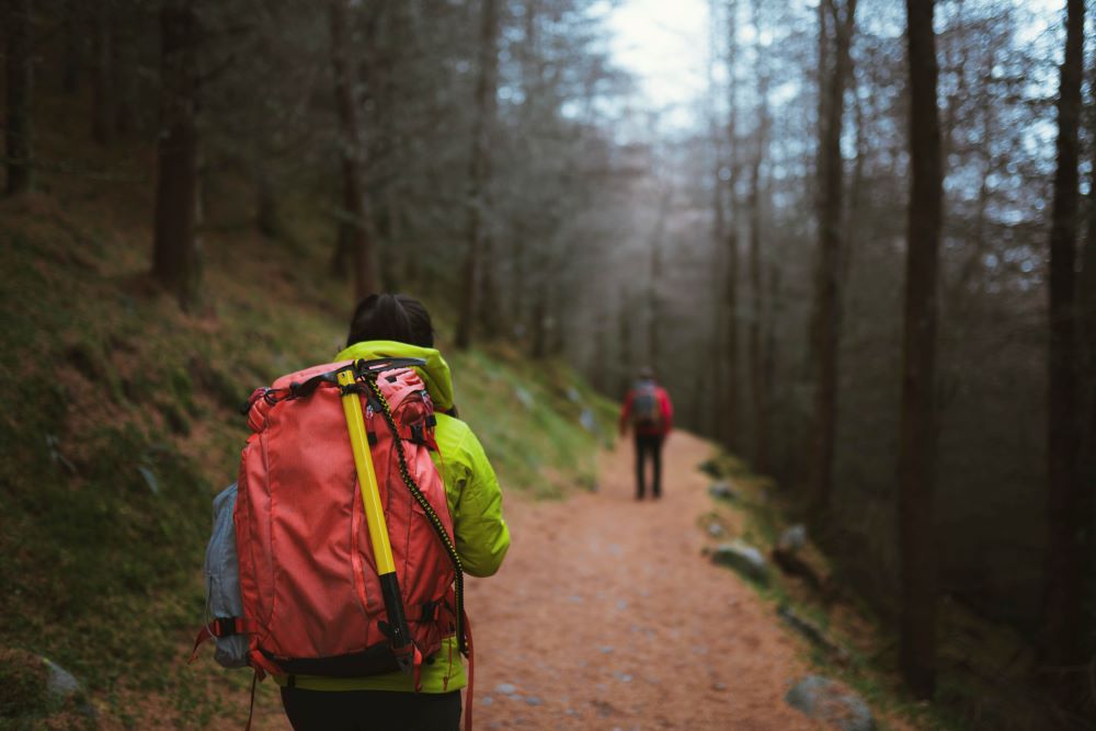 two hikers hiking in winter