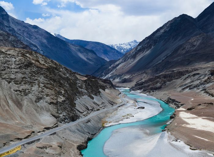 view of mountain and lake flowing