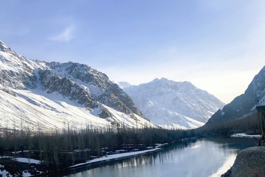 snow covered hills and a lake