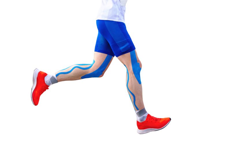 legs runner athlete in-blue kinesiotaping.