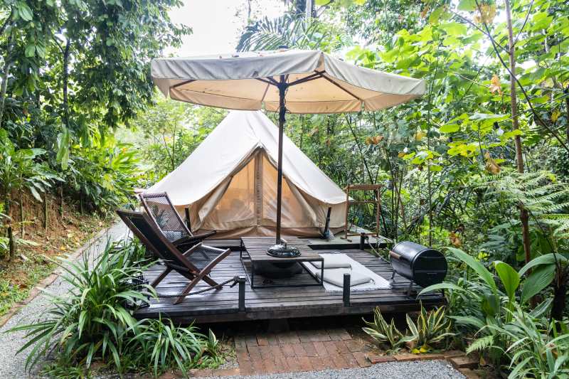 luxury glamping tent on wooden deck