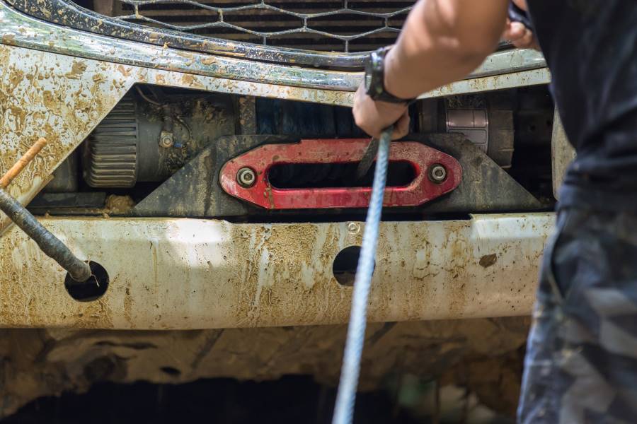 man using the winch device