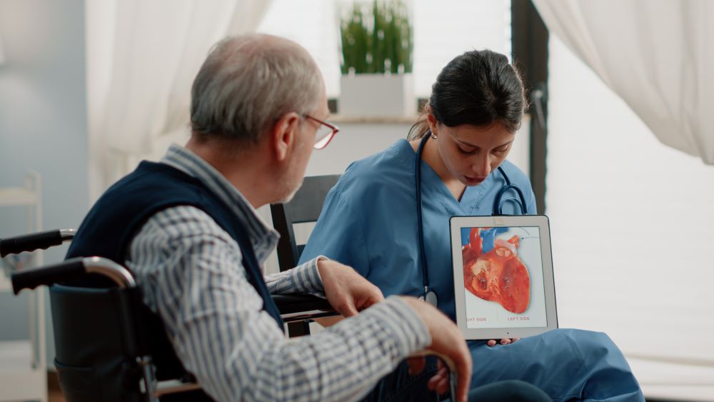 nurse-holding-tablet-with-heart-figure.jpg