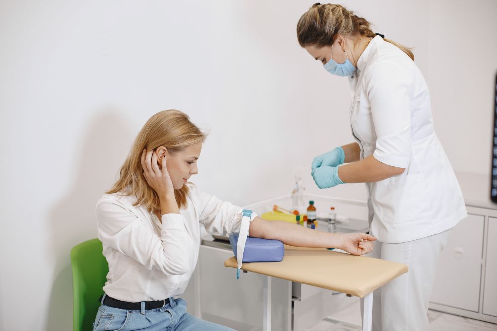 nurse-taking-blood-sample-from-patient