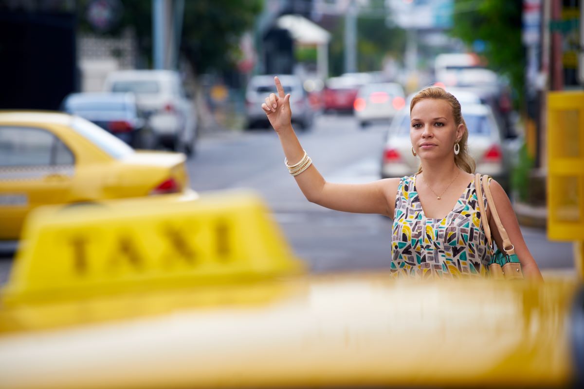 young lady calling taxi