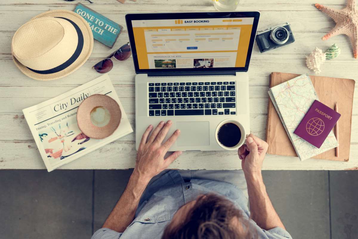 laptop and a cup of coffee on a table