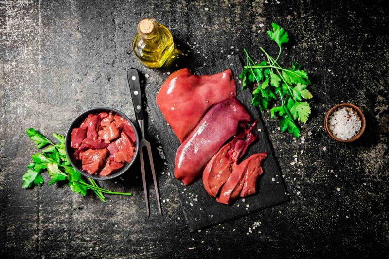 raw-liver-on-a-stone-board-with-parsley