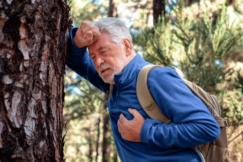 senior-bearded-man-walking-in-the-mountain