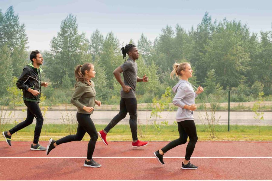 side-view-of-four-young-sportsmen-and-sportswomen