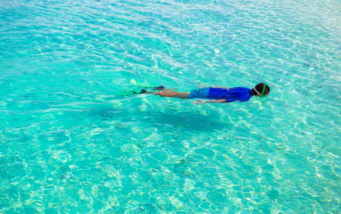 boy doing snorkelling in sea