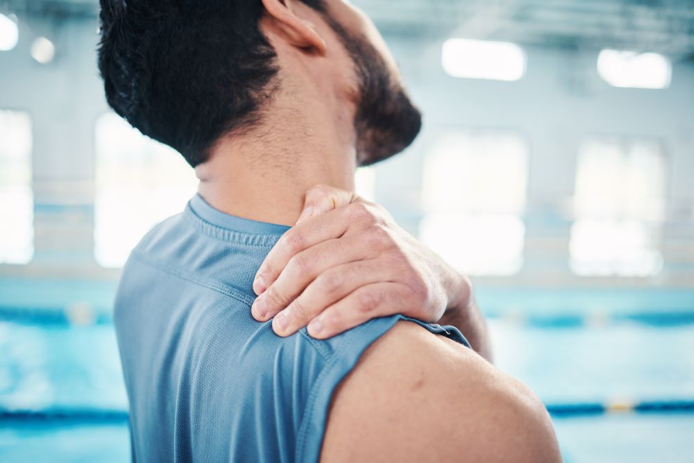 sports-neck-pain-and-man-by-swimming-pool