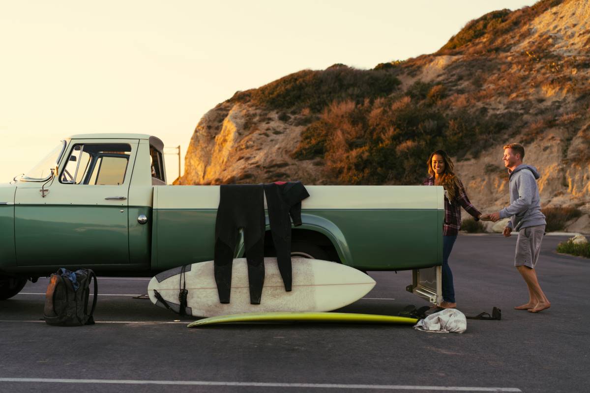 surfing couple with pickup truck