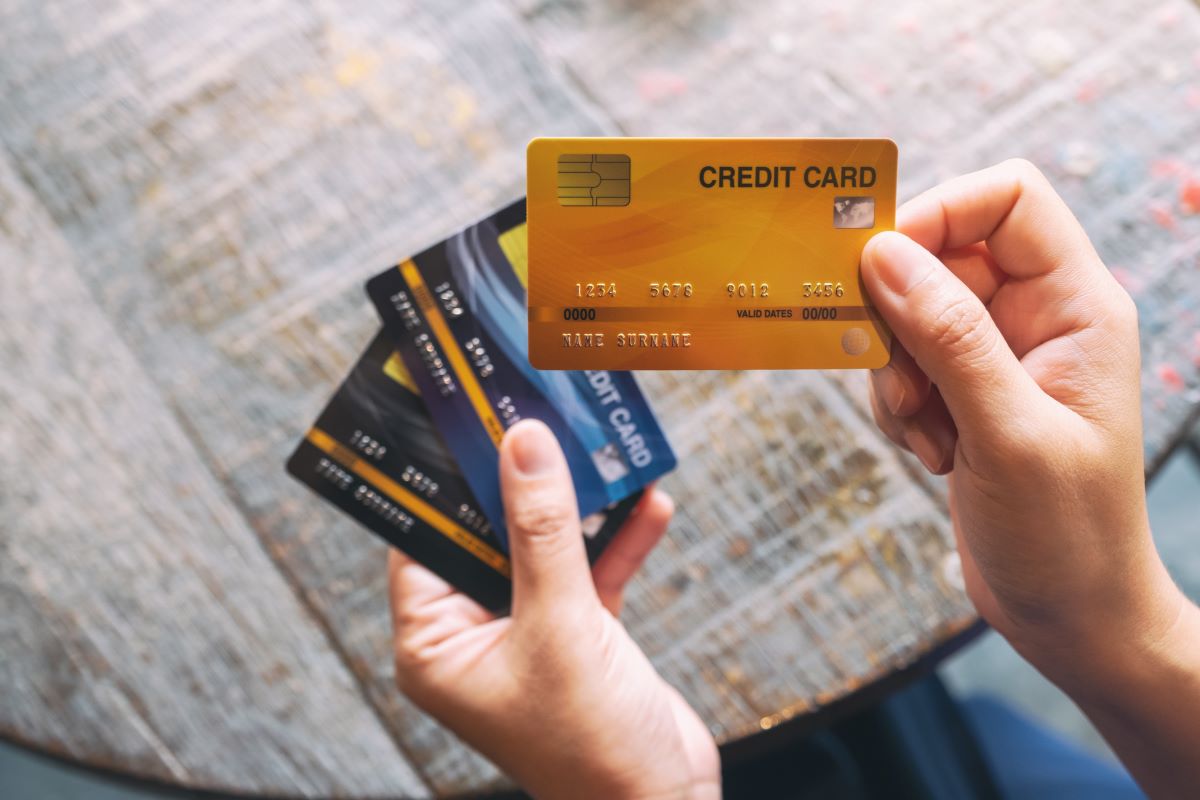 Top view of the woman carrying many credit cards in hand