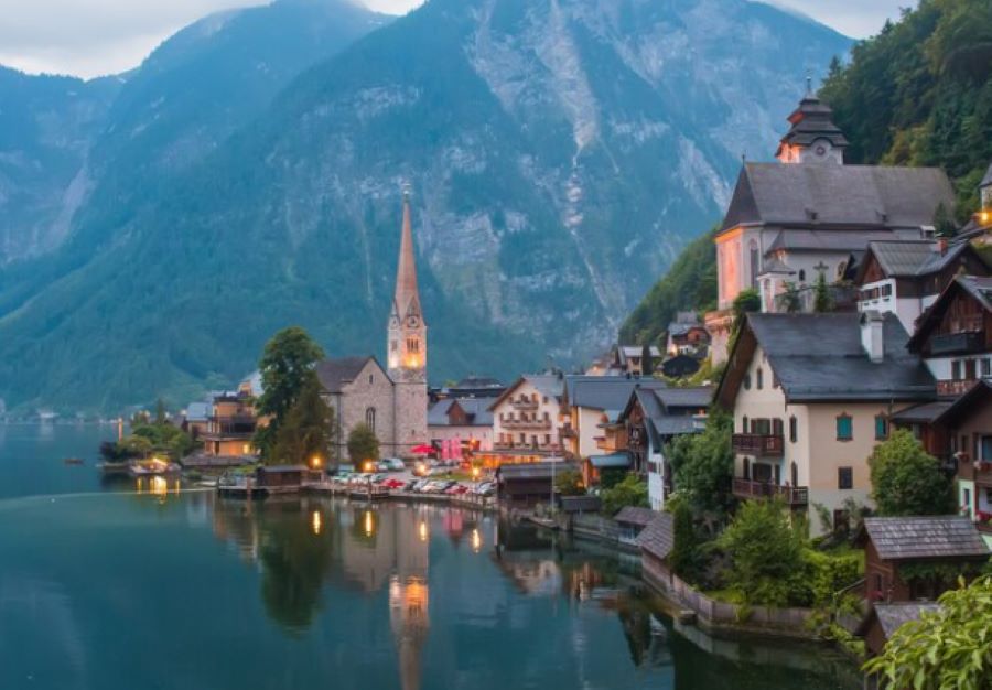 mountains and houses near lake