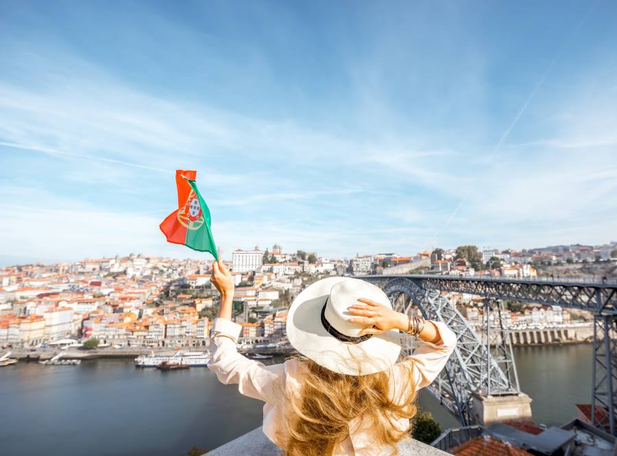 a girl waiving portugal flag