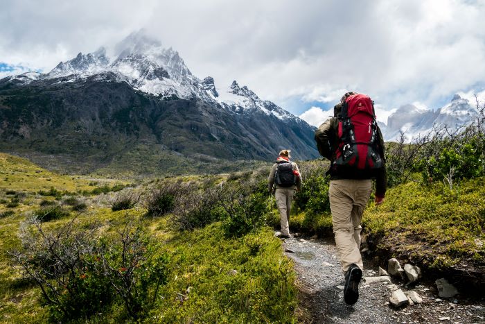 two hikers moving forwards