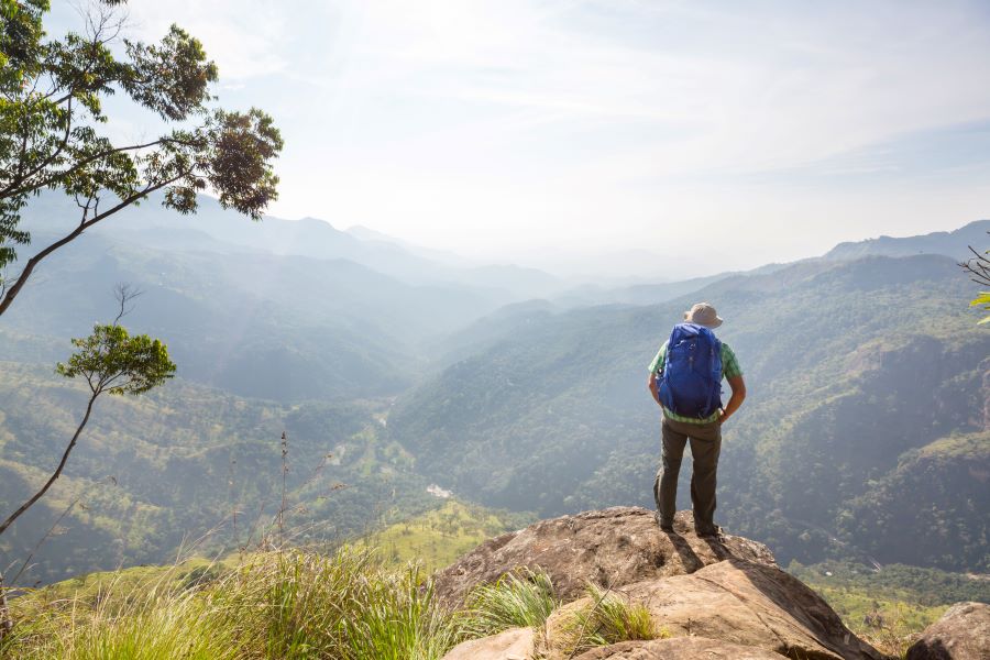 a single man standing on the rock