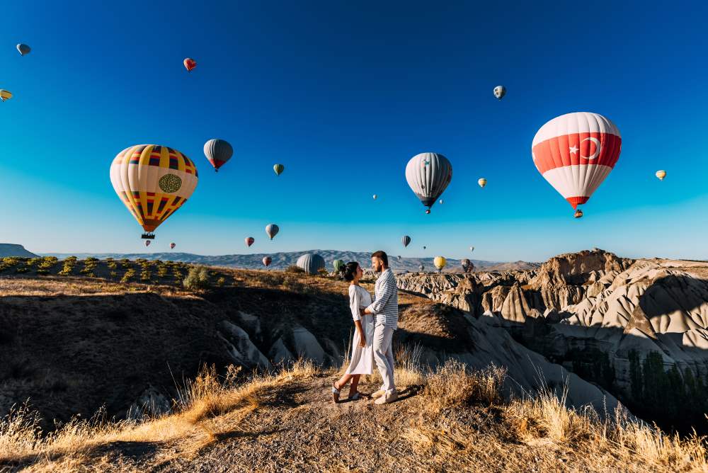 couple on mountain in cappadocia