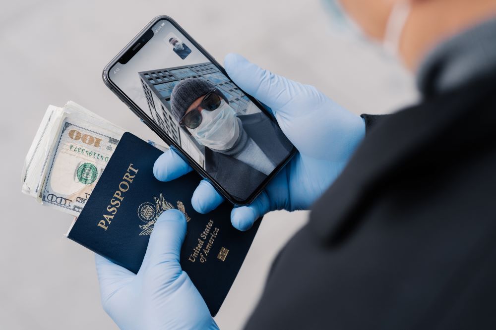 man has video call talks with friend by holding passport