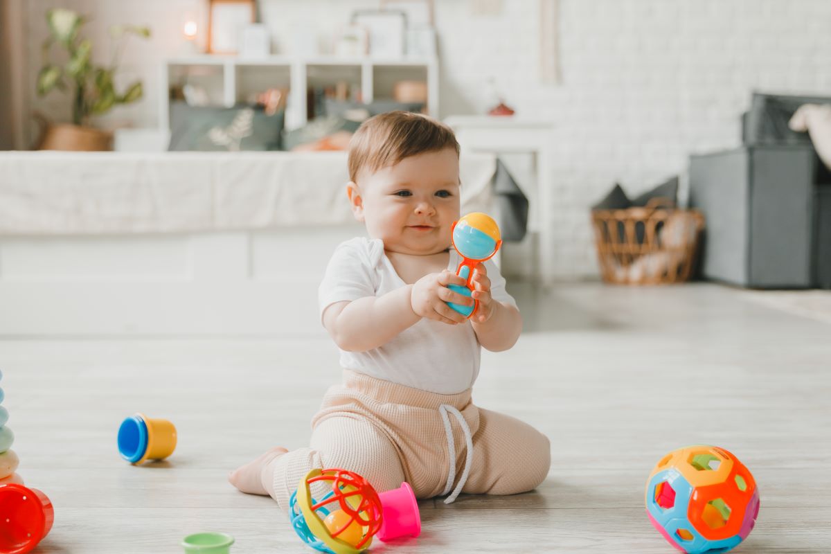 a 6 month old baby playing