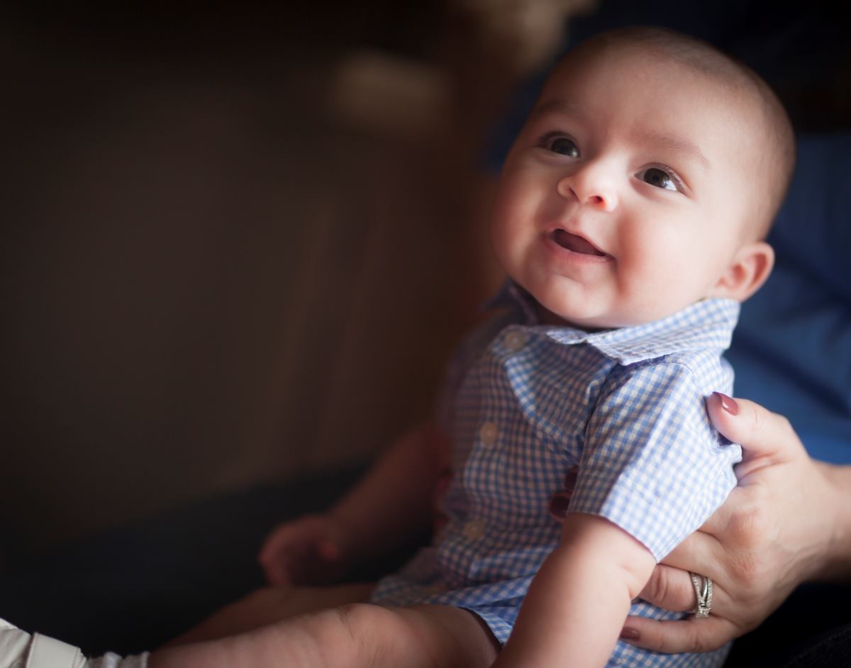 baby boy held by parent