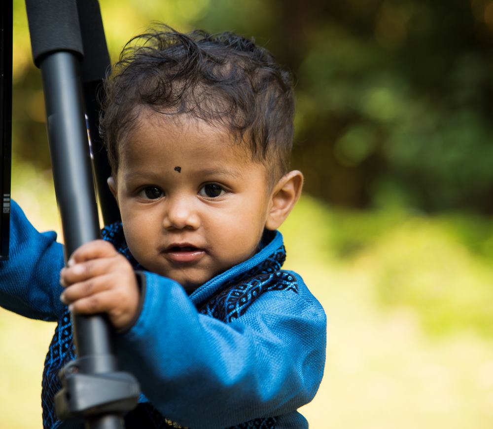 baby boy playing in garden