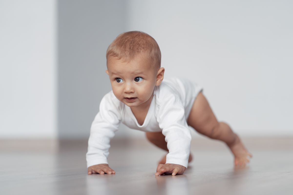 baby trying to take first step