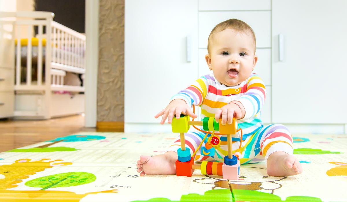 baby playing with educational toy